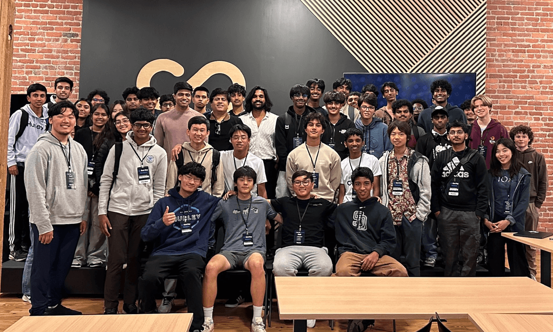 A group of smiling hackathon participants